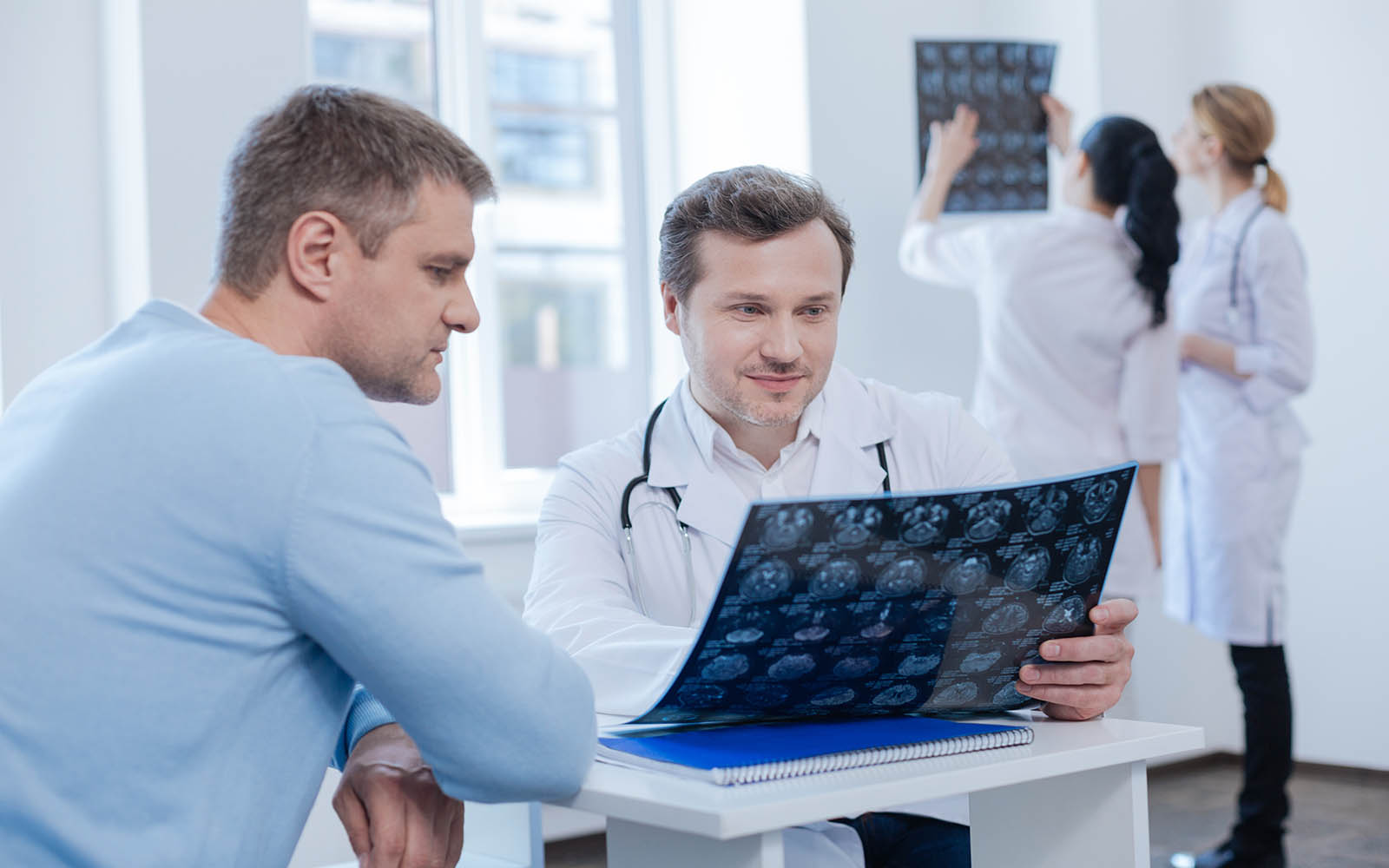 Charismatic,Therapist,Consulting,Patient,In,The,Medical,Cabinet
